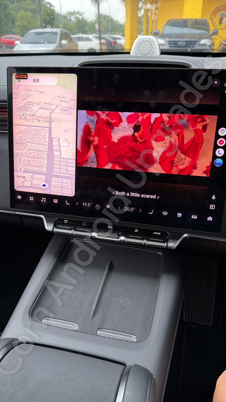 Customer car display showing a navigation map beside a video